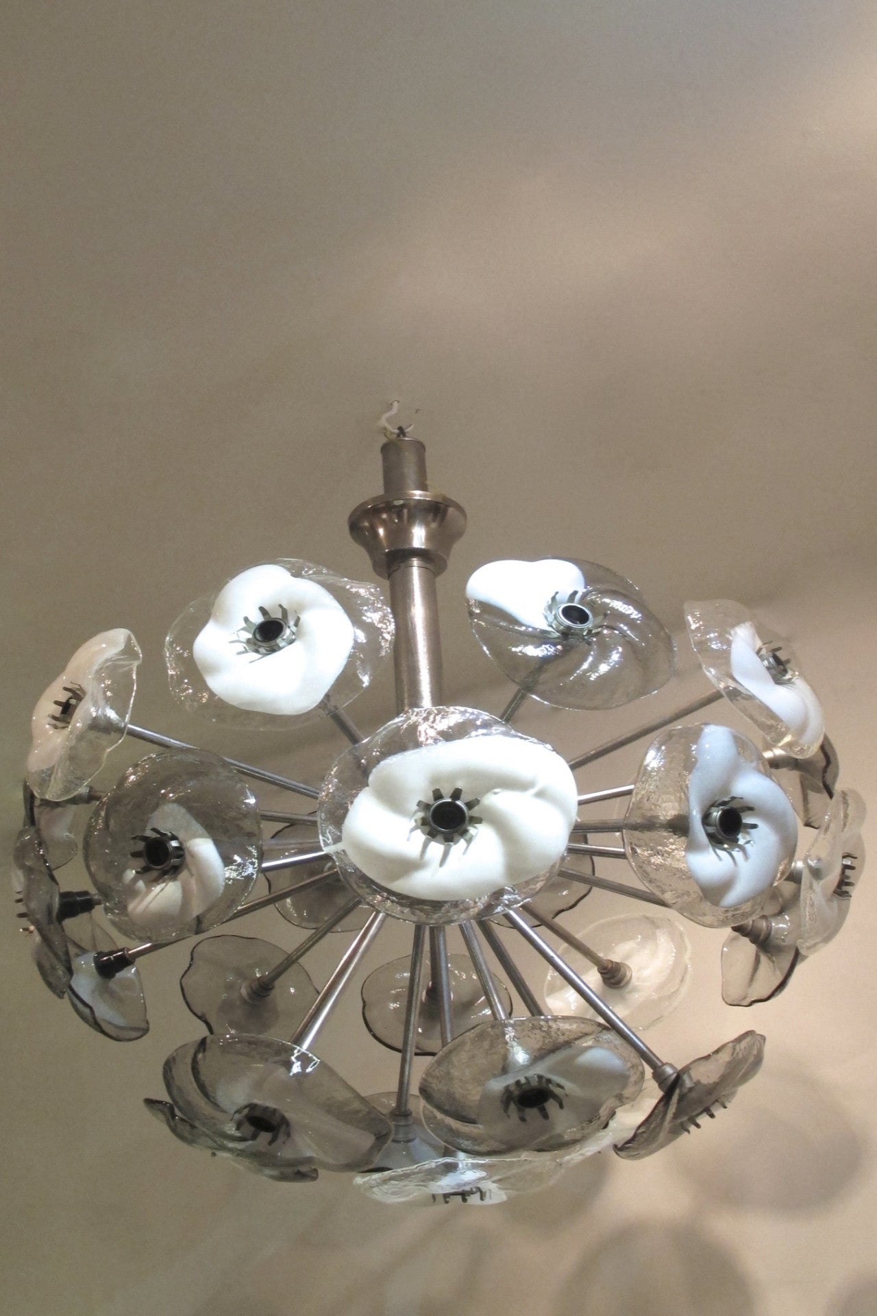 A large and impressive 1970s murano glass chandelier modelled as glass flowers on a chrome frame.
