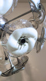 A large and impressive 1970s murano glass chandelier modelled as glass flowers on a chrome frame.