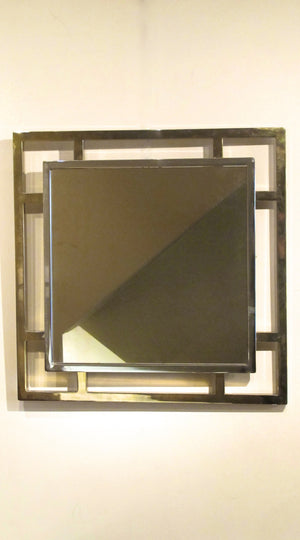A very decorative 1970s mirror with chrome and brass finish.