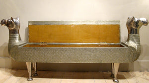 X A fabulous silvered hall bench modelled as a camel with lift up lid and internal storage.Last quarter 20th c.