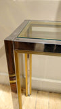 A large chrome 1970s console with brass edge detail