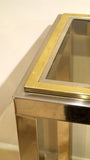A 1970s brass and chrome console of petite size.