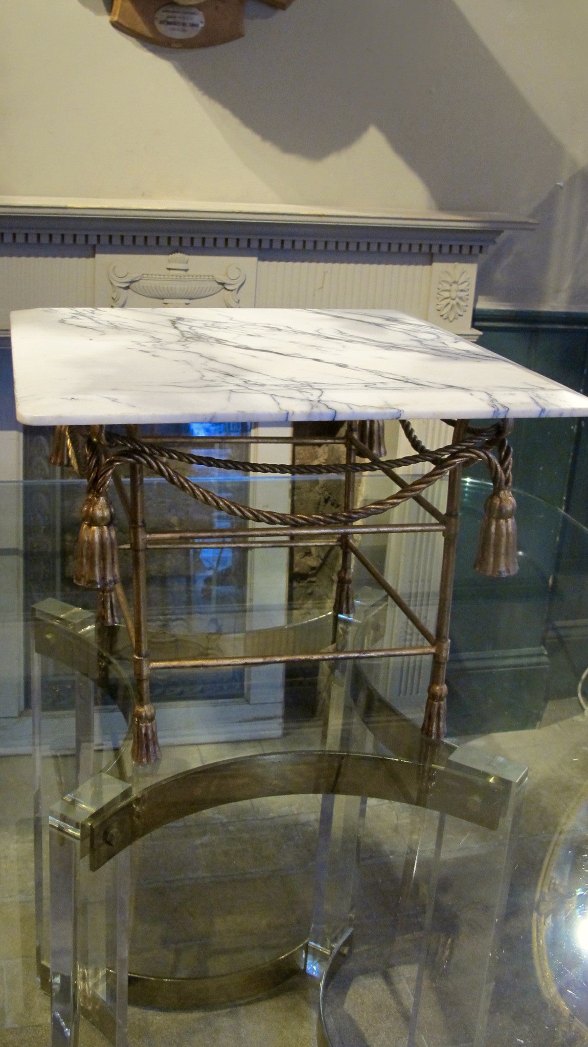 X Italian gilded table base with arabescato marble top.