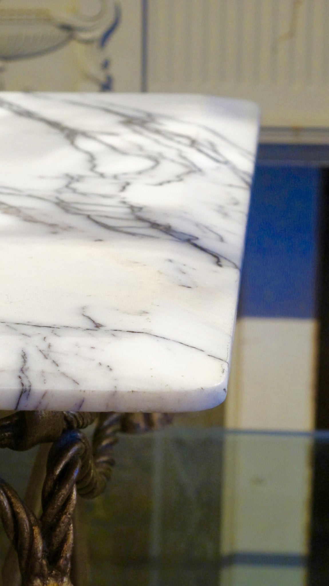 X Italian gilded table base with arabescato marble top.
