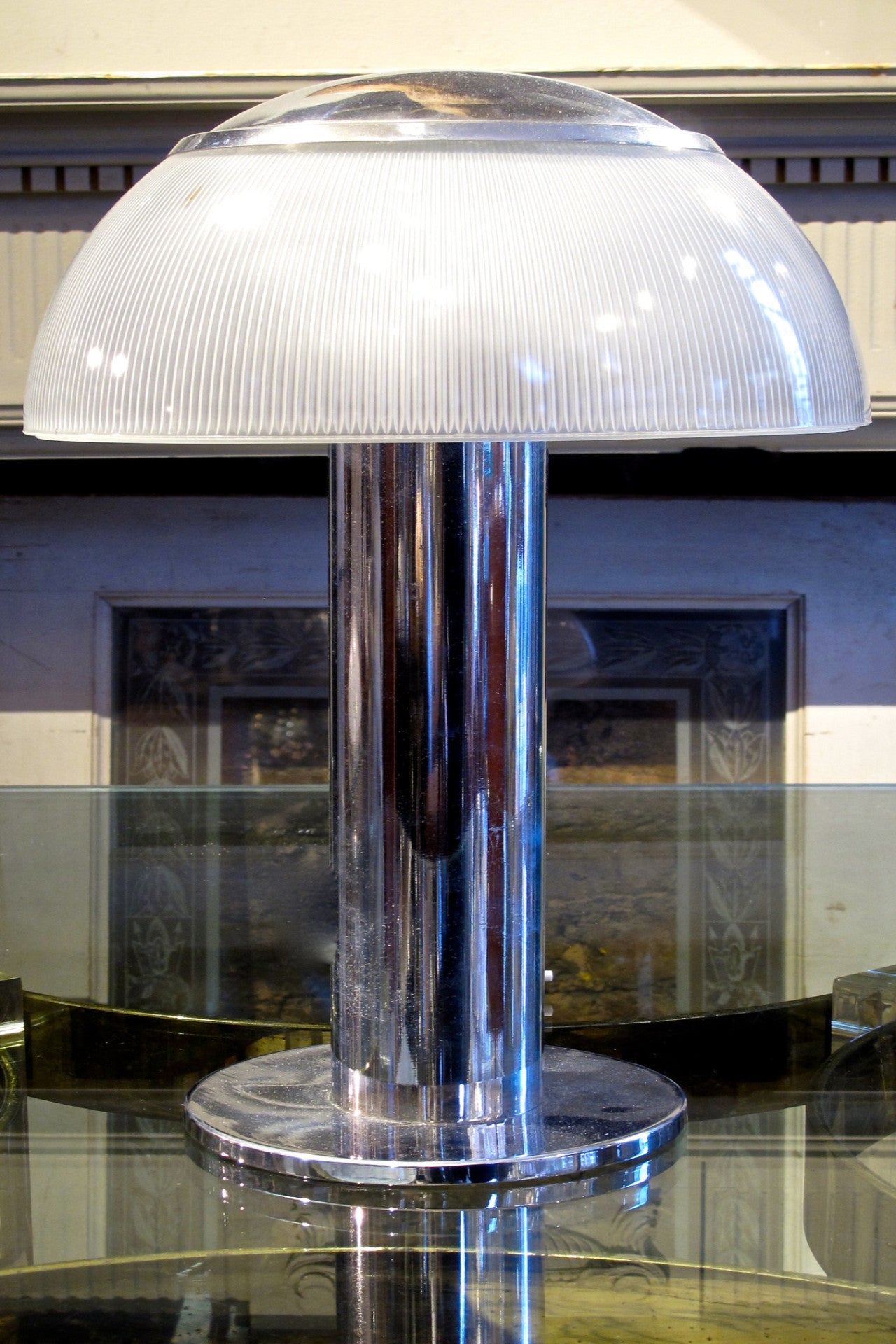 X A 1970s chrome and glass shaded table lamp . In the modernist style.