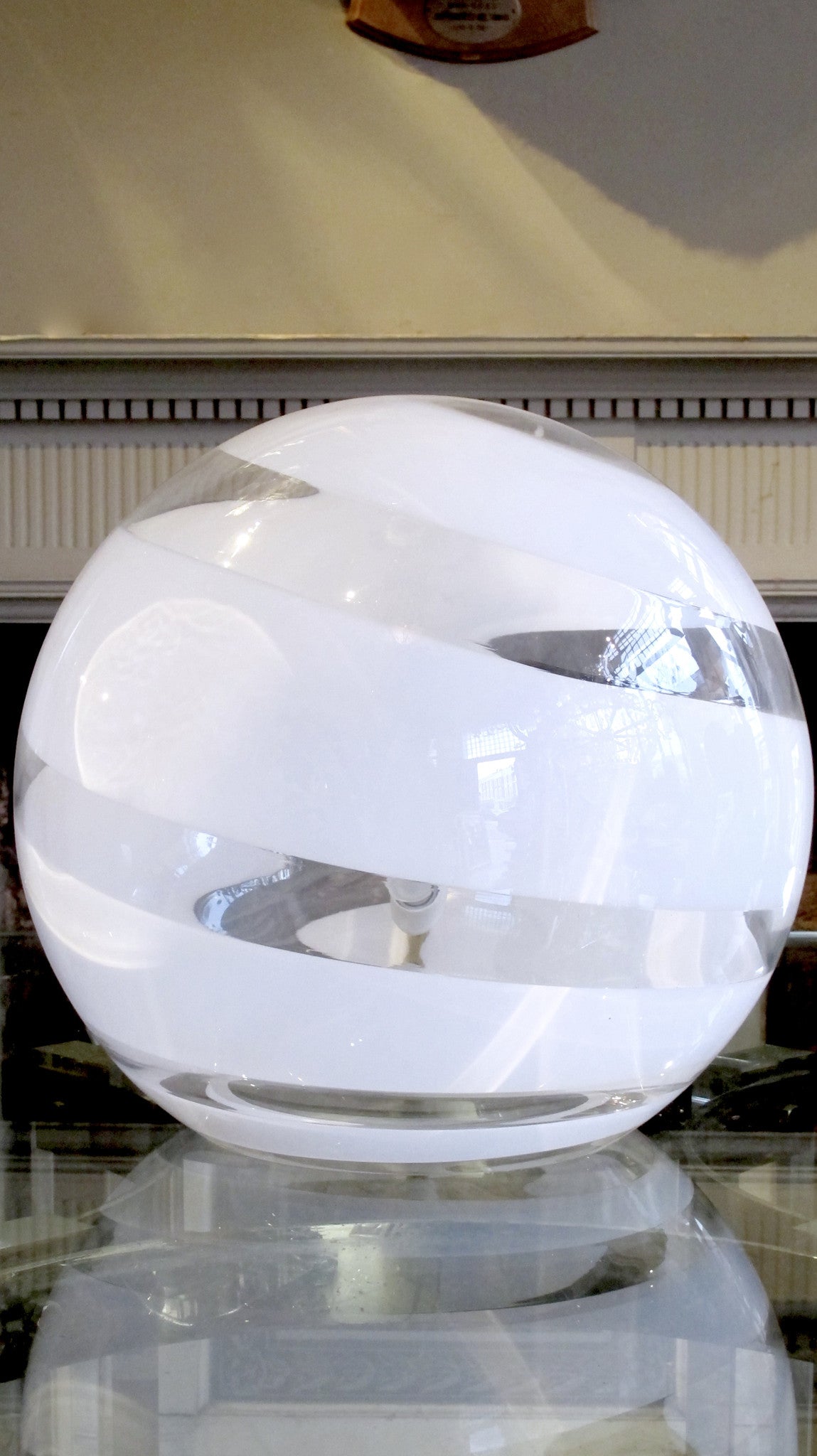 X late 1970s glass ball table lamp with white swirl.