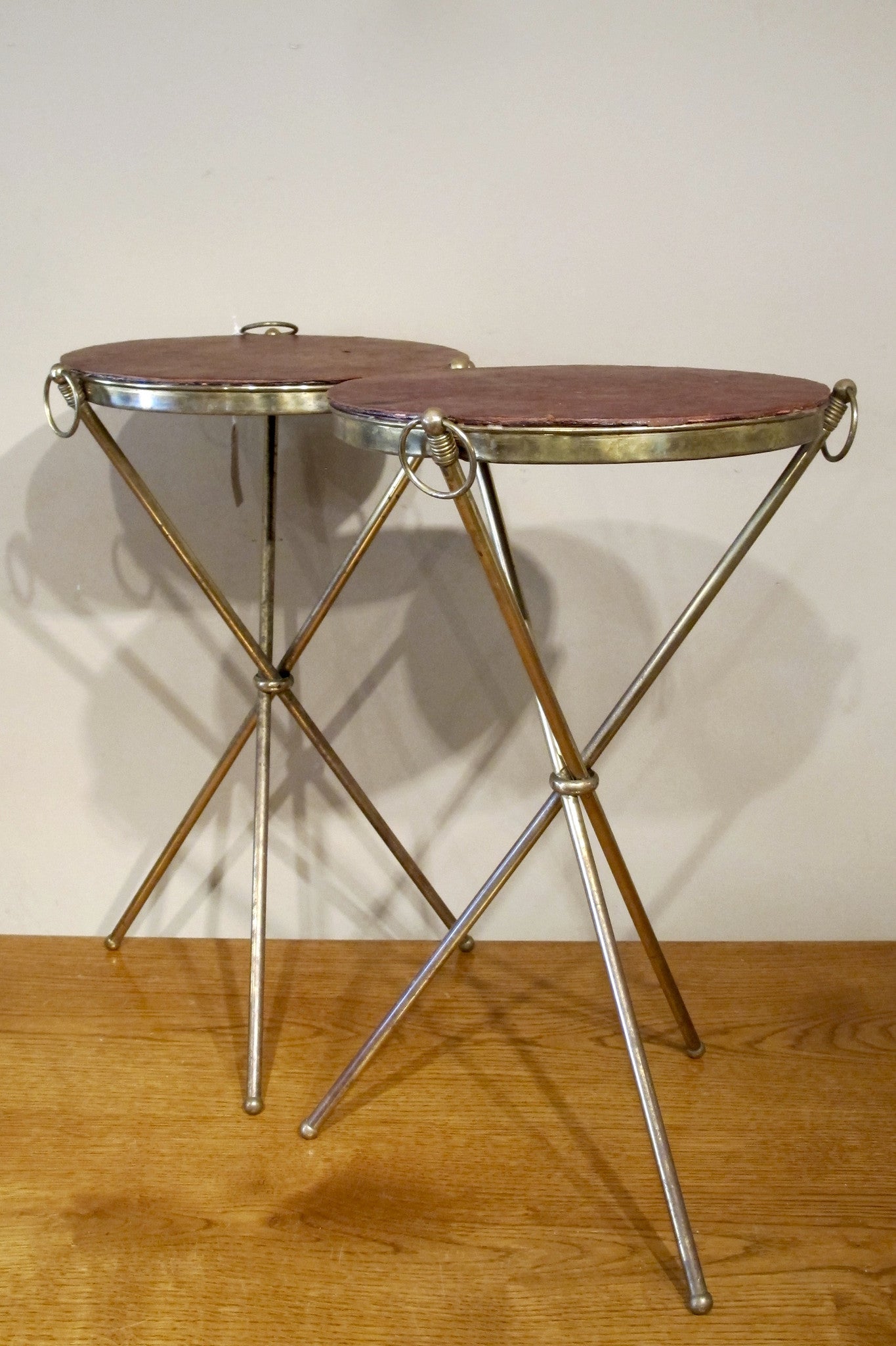 X Pair of decorative brass side  tables with leather tops.