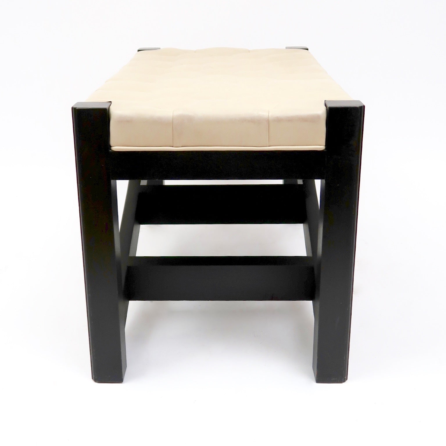 Leather topped stool which doubles as library steps.