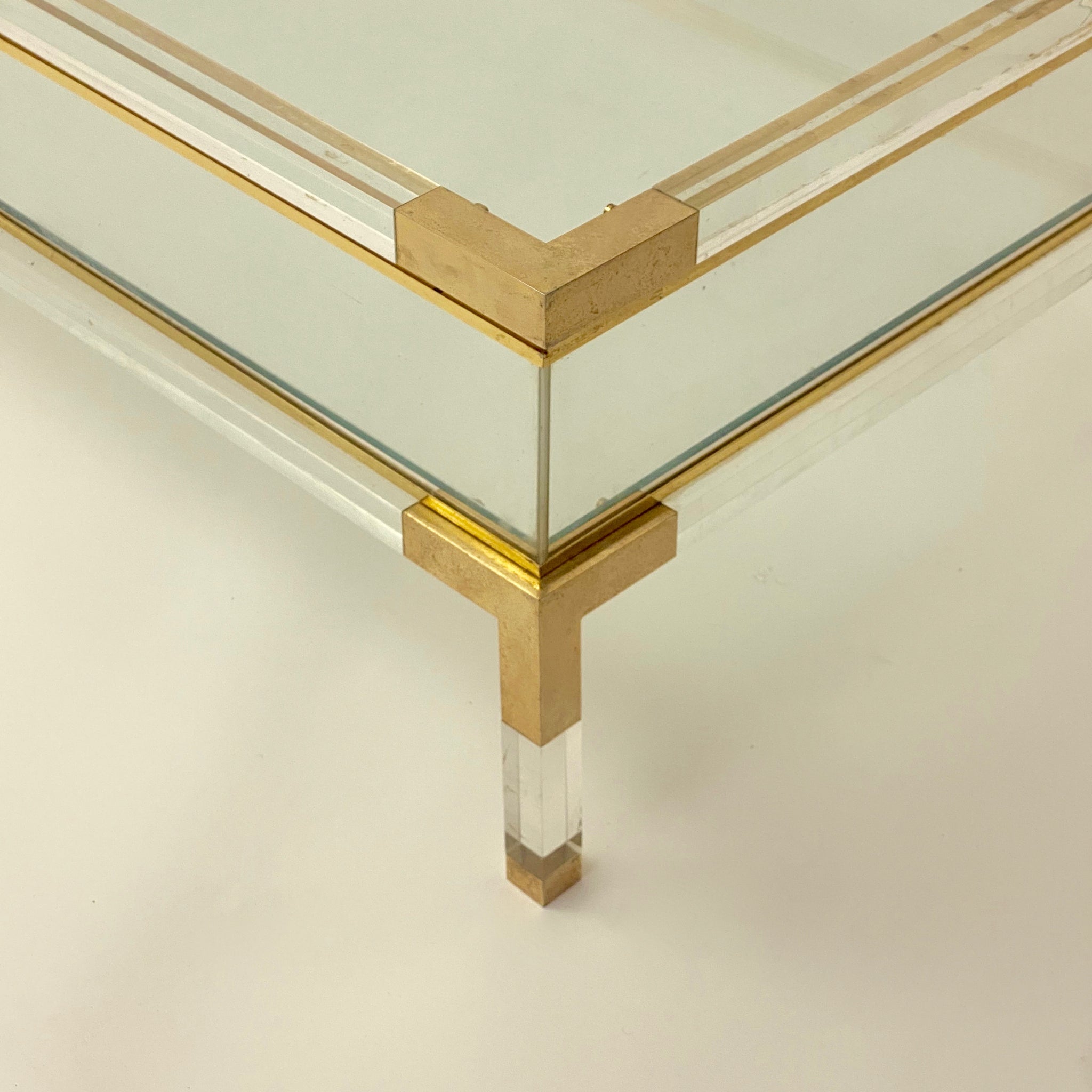 Vintage French perspex and brass coffee table with sliding top .