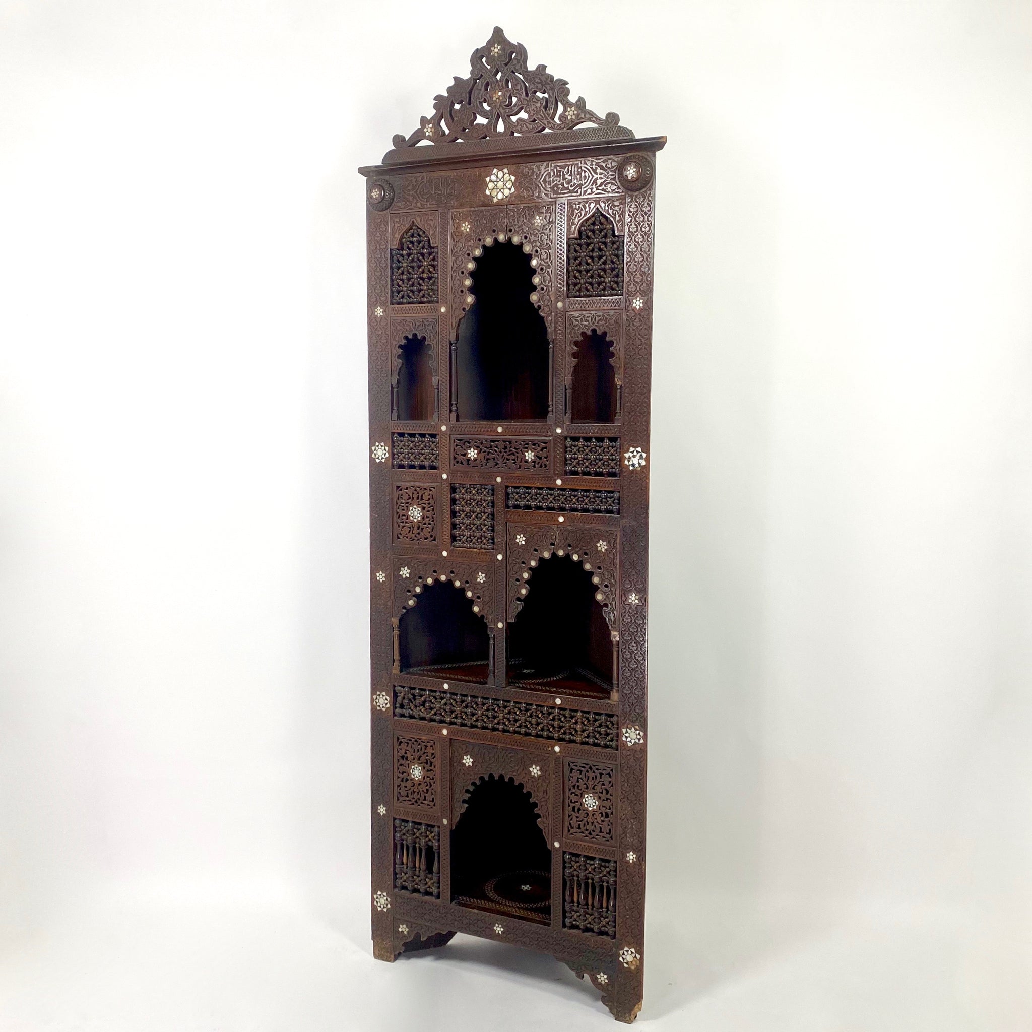 Highly decorative early 20th century corner cabinet.