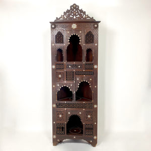 Highly decorative early 20th century corner cabinet.
