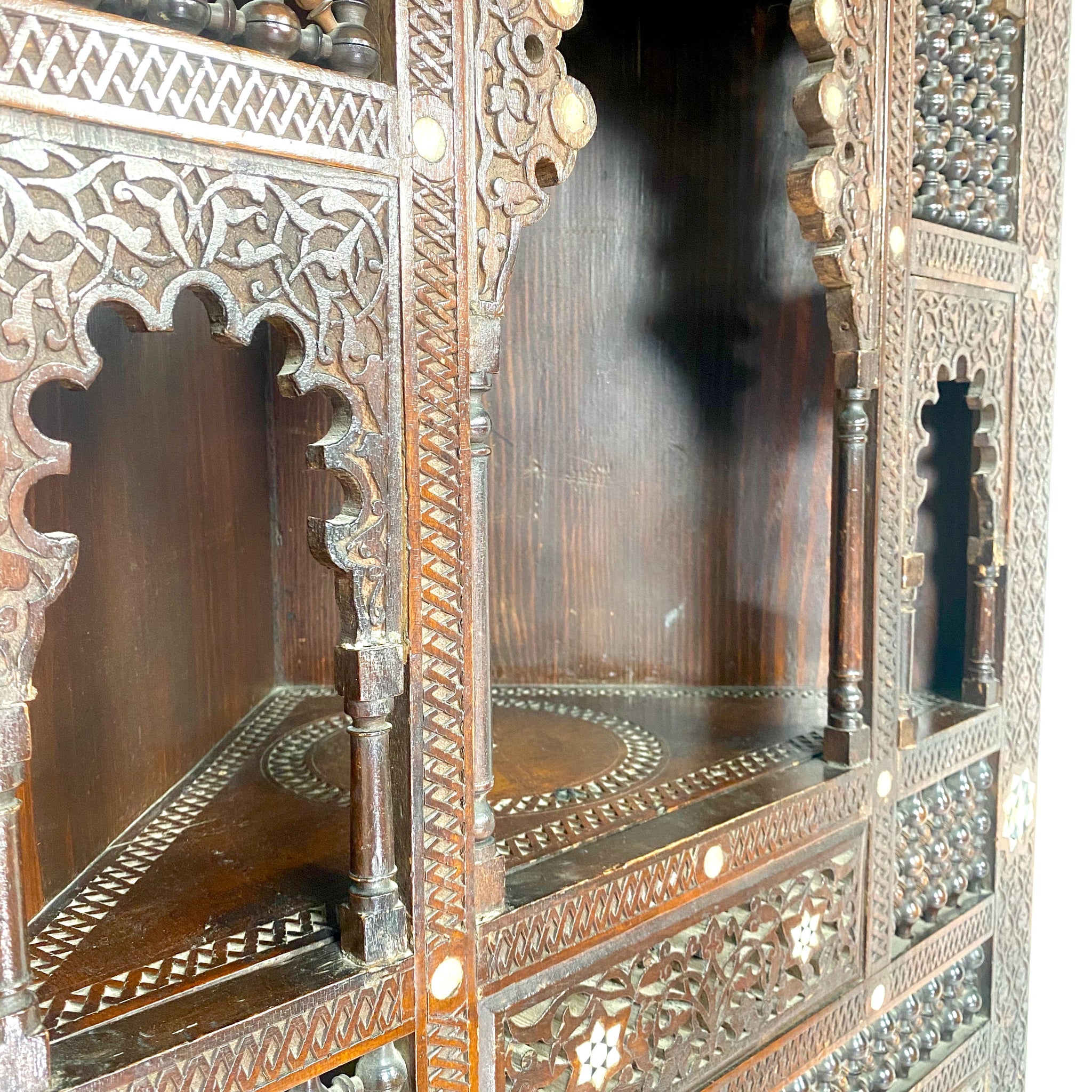 Highly decorative early 20th century corner cabinet.