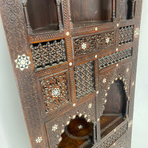 Highly decorative early 20th century corner cabinet.