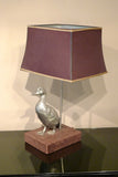 X A 1970s table lamp modelled as a duck on a velvet base.