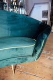 Italian curved 50's style sofa newly upholstered in green velvet.
