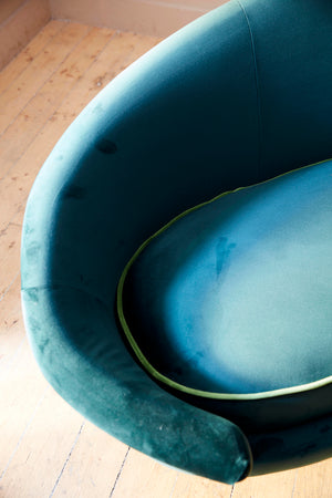 Italian curved 50's style sofa newly upholstered in green velvet.