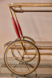 Whimsical Italian 1950's brass trolley with bar accesories.