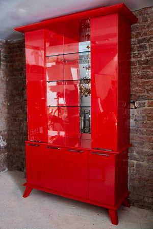 late twentieth century red lacquer cabinet of chinoiserie  influence.