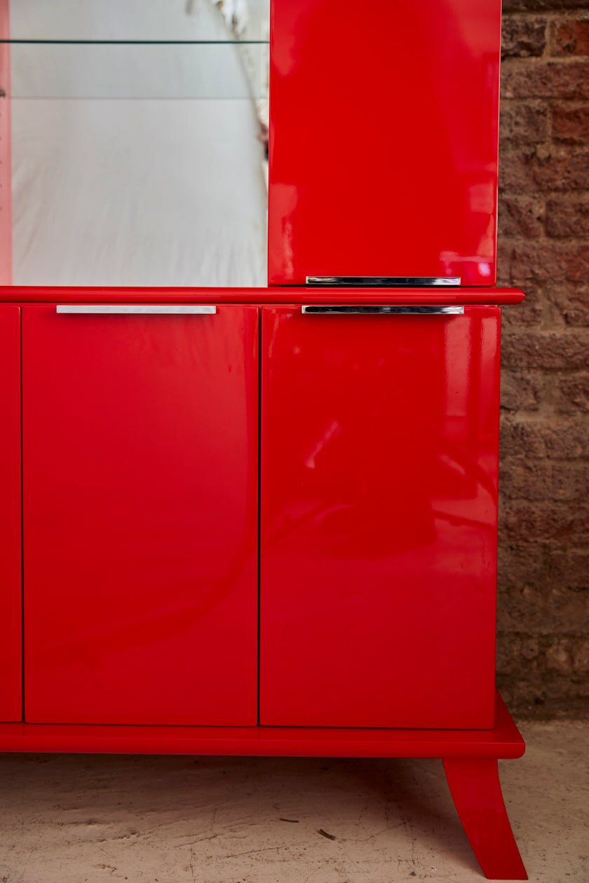 late twentieth century red lacquer cabinet of chinoiserie  influence.