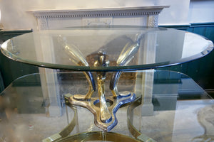 X Brass Coffee Table With stylised base featuring 3 birds, with a bevelled glass top.