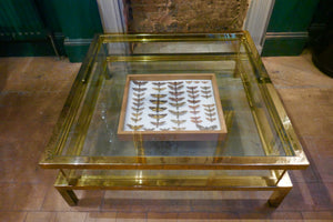 Brass coffee table with sliding top circa 1970in the Maison Jansen style.