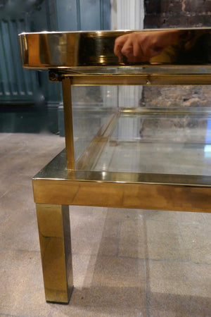 Brass coffee table with sliding top circa 1970in the Maison Jansen style.