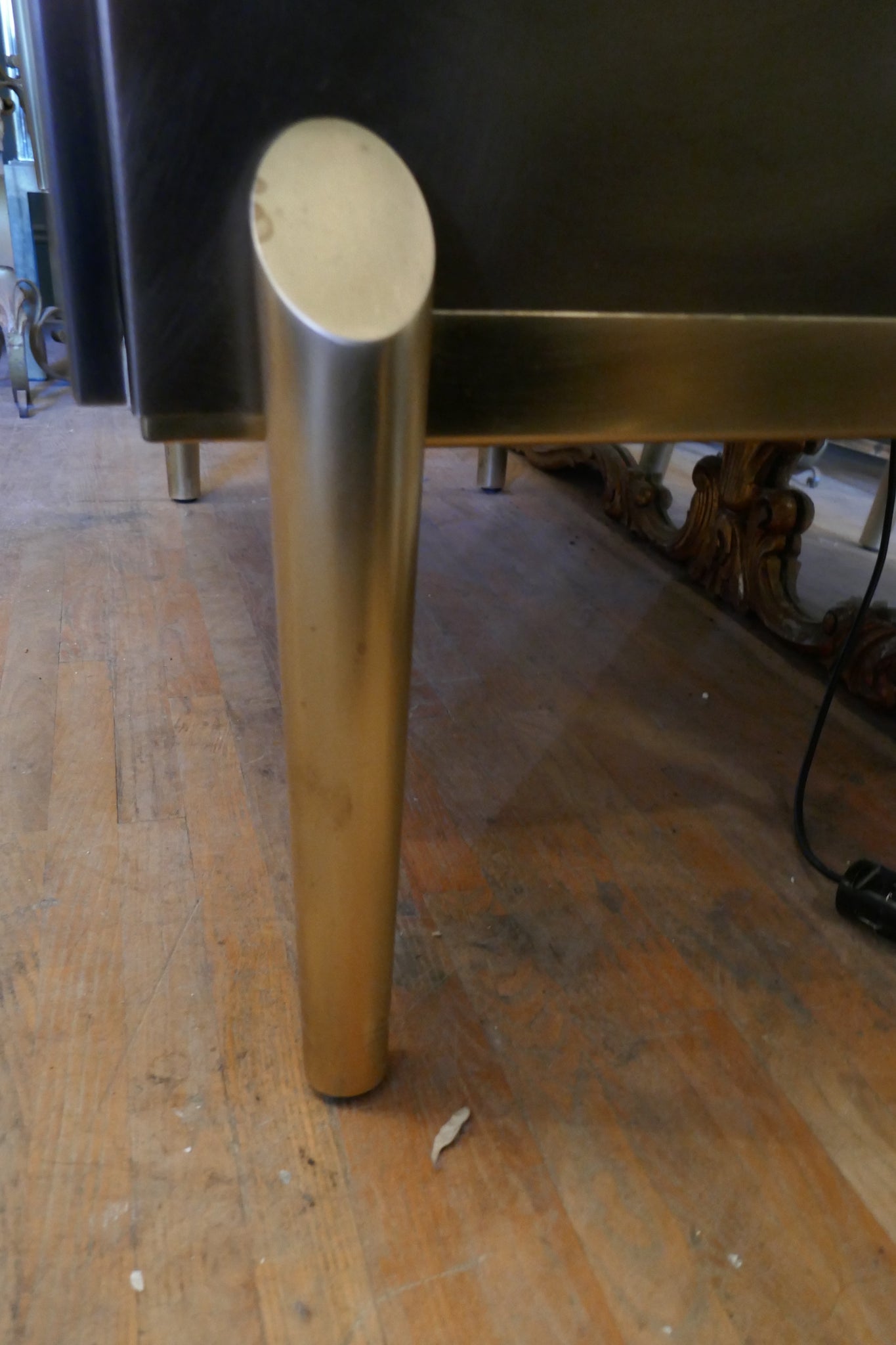 Steel and brass cocktail bar with mirrored interior circa 1970 .