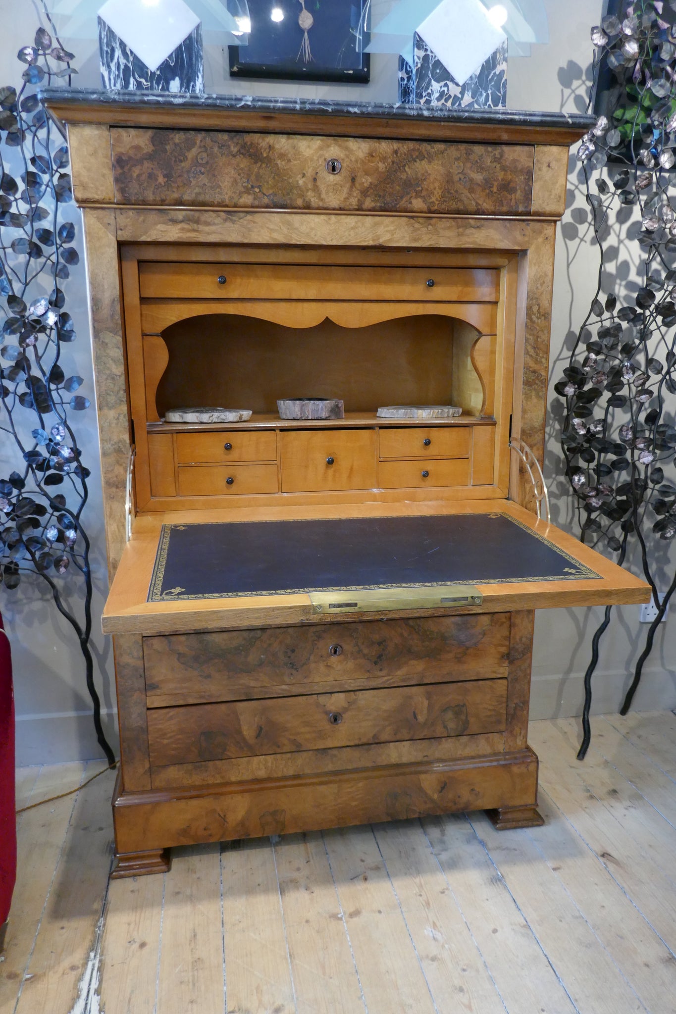 Elegant Biedermeier secretaire with variegated marble top .