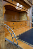 Elegant Biedermeier secretaire with variegated marble top .
