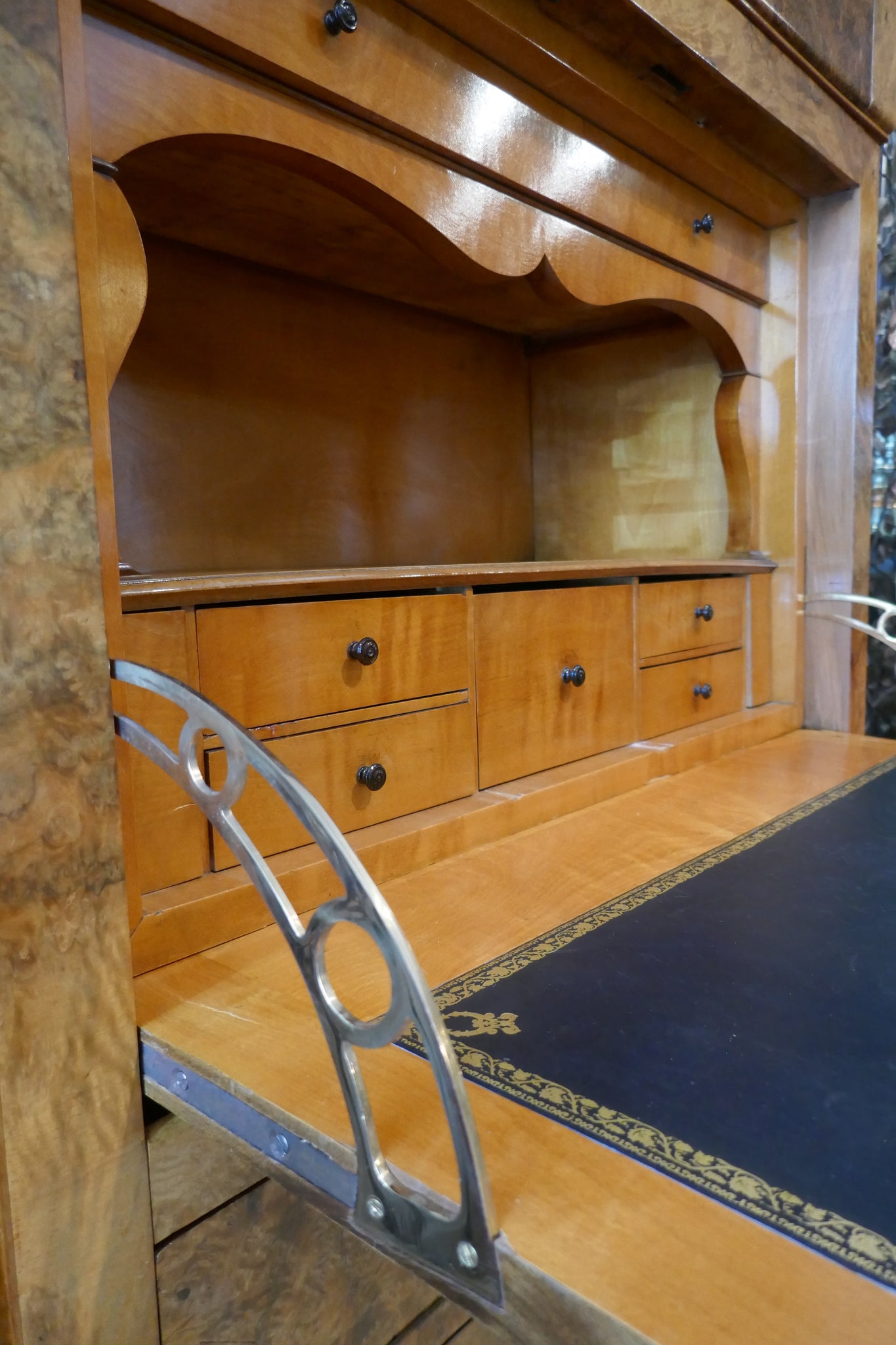 Elegant Biedermeier secretaire with variegated marble top .