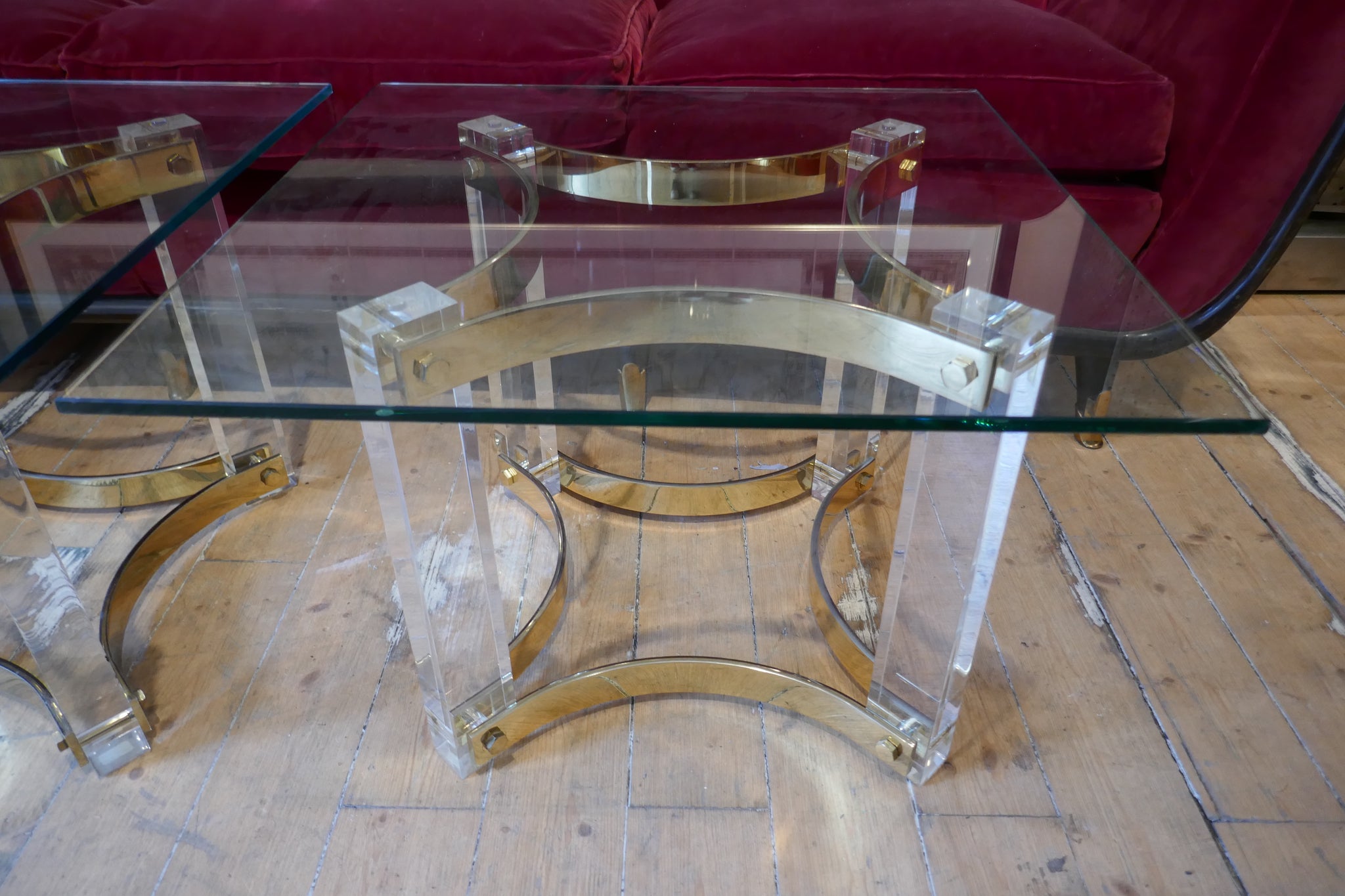 Decorative pair of 1970's lucite and brass side tables