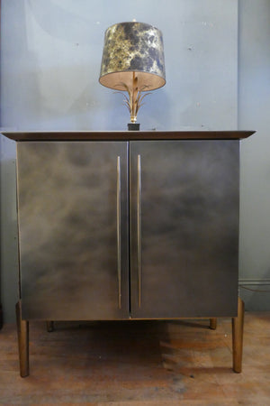 Steel and brass cocktail bar with mirrored interior circa 1970 .