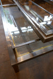 Unusual rectangular Steel and glass coffee table with sliding top in the style of Maison Jansen.