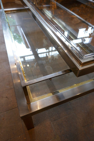 Unusual rectangular Steel and glass coffee table with sliding top in the style of Maison Jansen.
