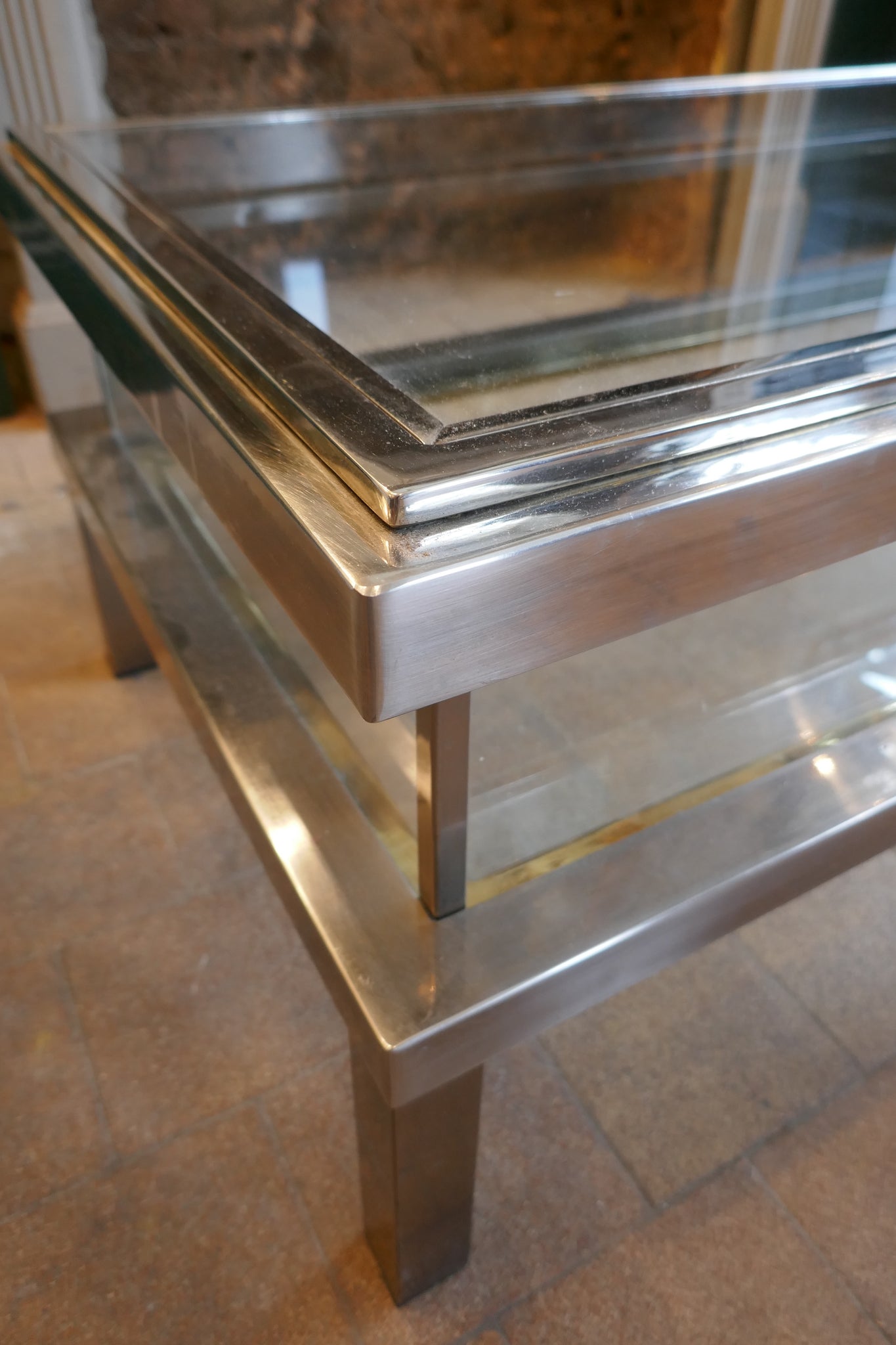 Unusual rectangular Steel and glass coffee table with sliding top in the style of Maison Jansen.