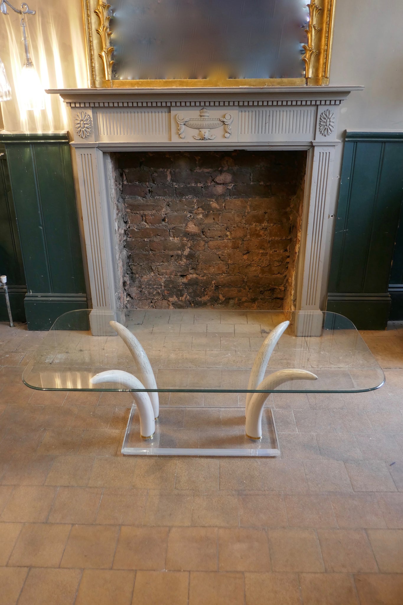 Decorative 1970's coffee table with RESIN faux tusk supports .
