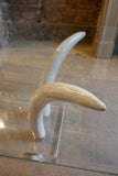 Decorative 1970's coffee table with RESIN faux tusk supports .