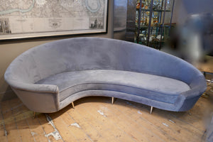 Curved Italian sofa 1960's style  upholstered in grey velvet .