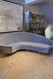 Curved Italian sofa 1960's style  upholstered in grey velvet .