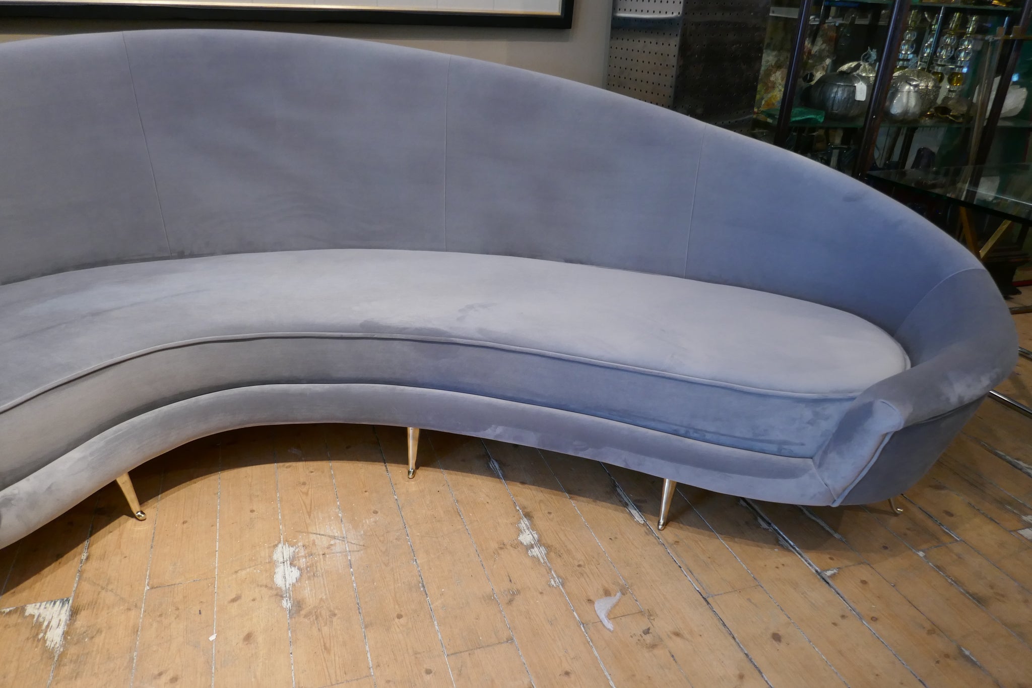 Curved Italian sofa 1960's style  upholstered in grey velvet .
