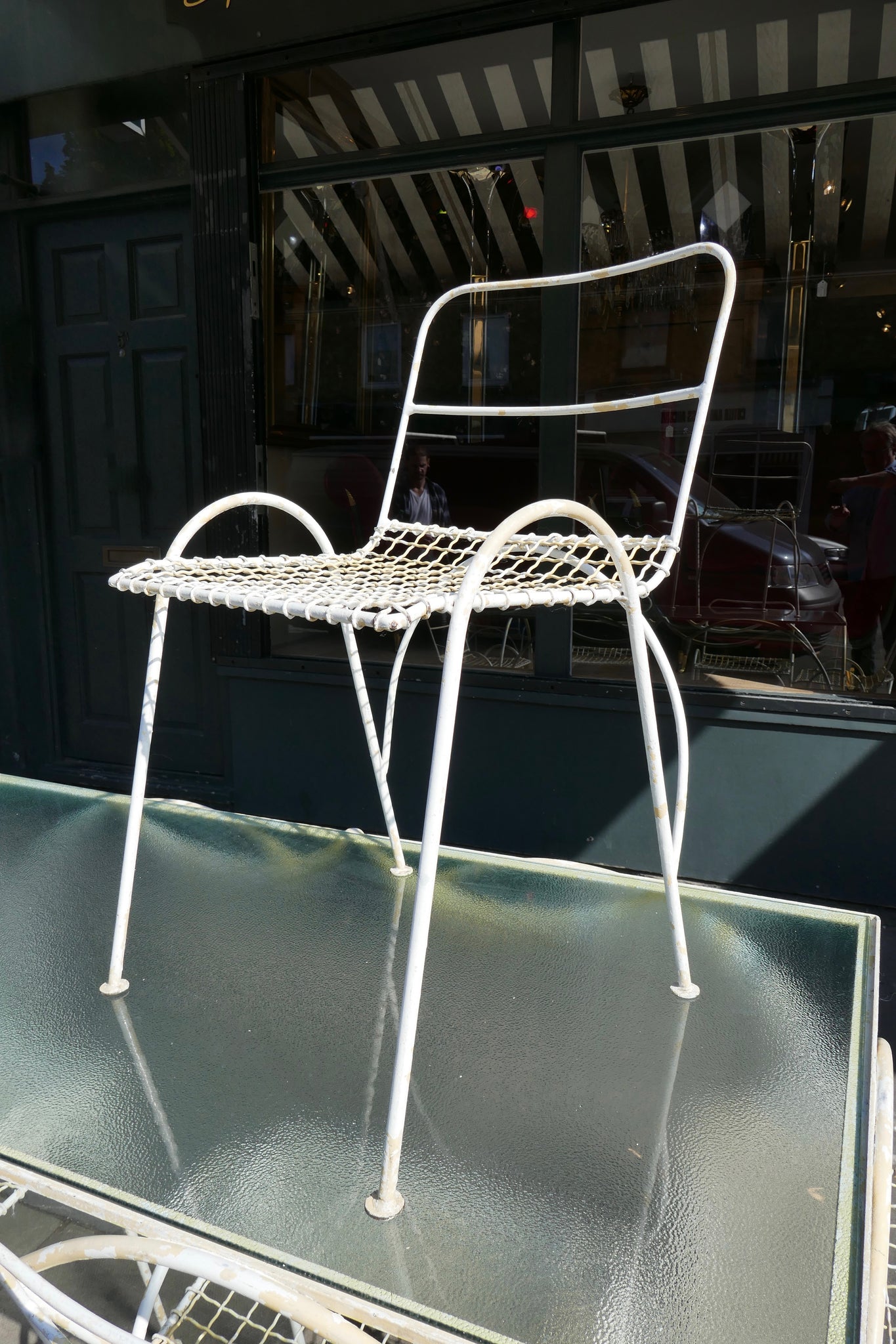 Decorative french 1950's garden table and six chairs.
