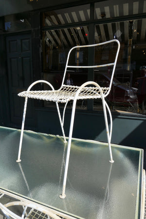 Decorative french 1950's garden table and six chairs.