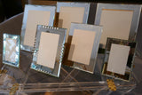 Set of 7 french 1950's mirrored photo frames of various sizes.