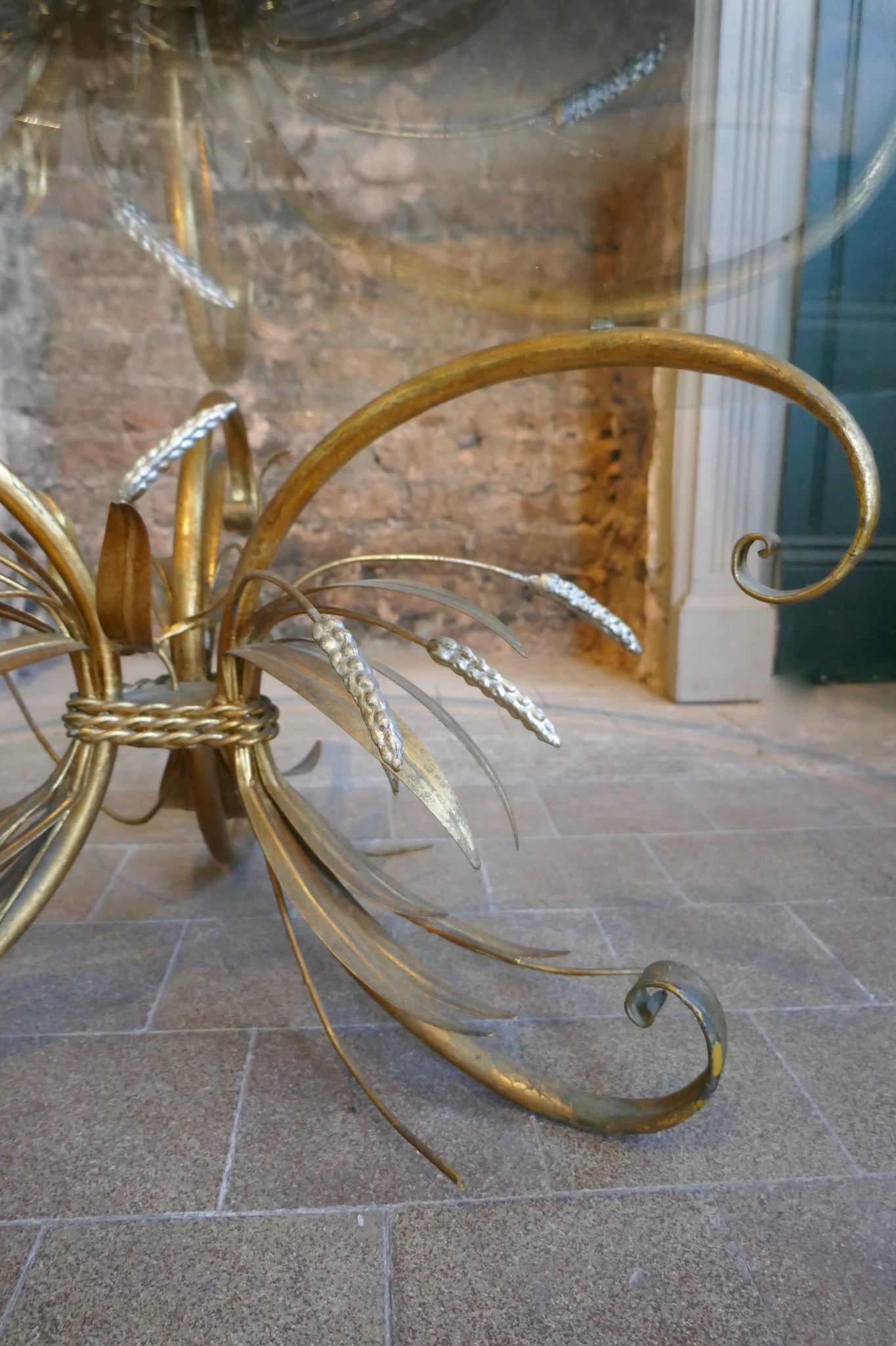 Large 1950's Italian wheatsheaf table with bevelled glass top .