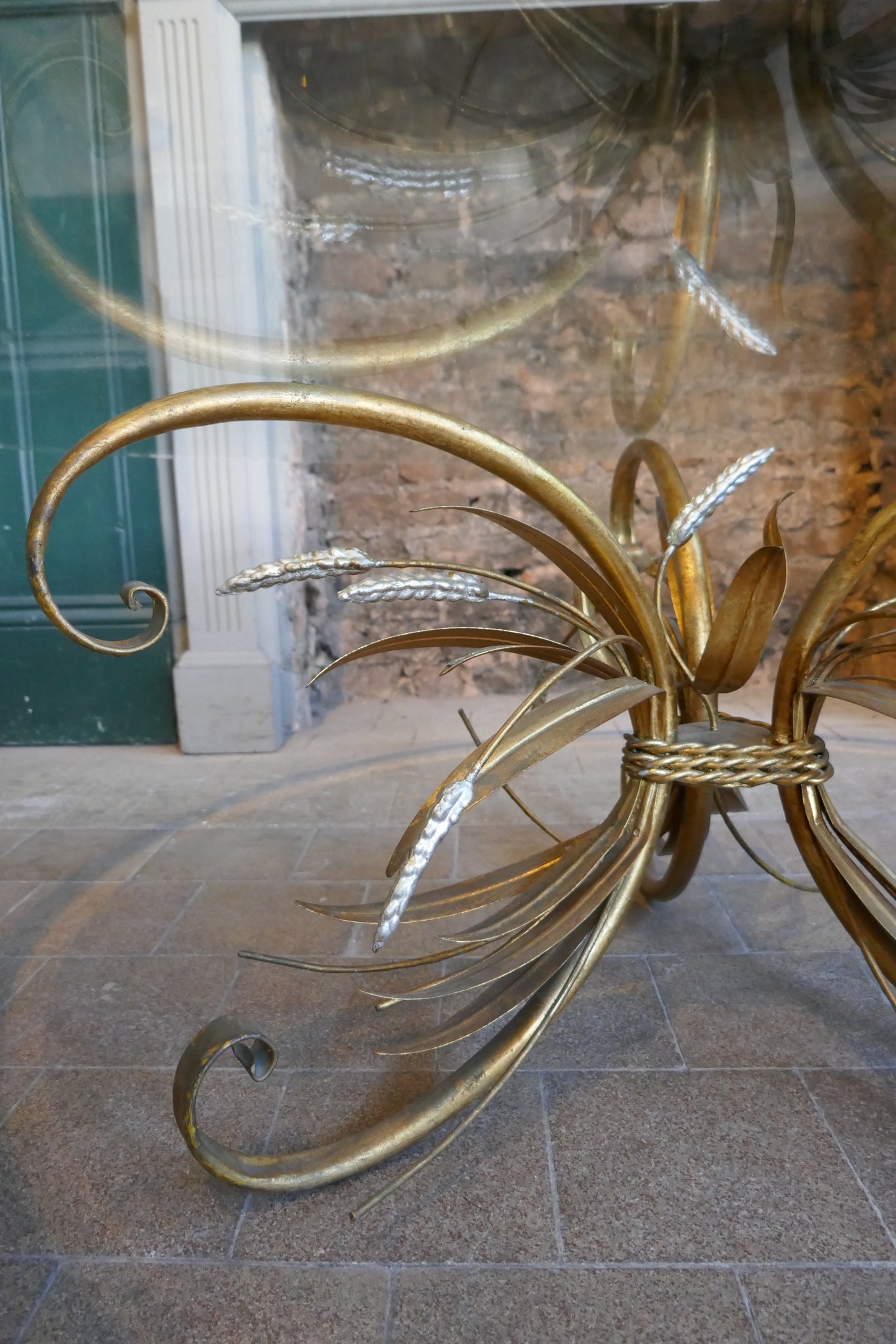 Large 1950's Italian wheatsheaf table with bevelled glass top .