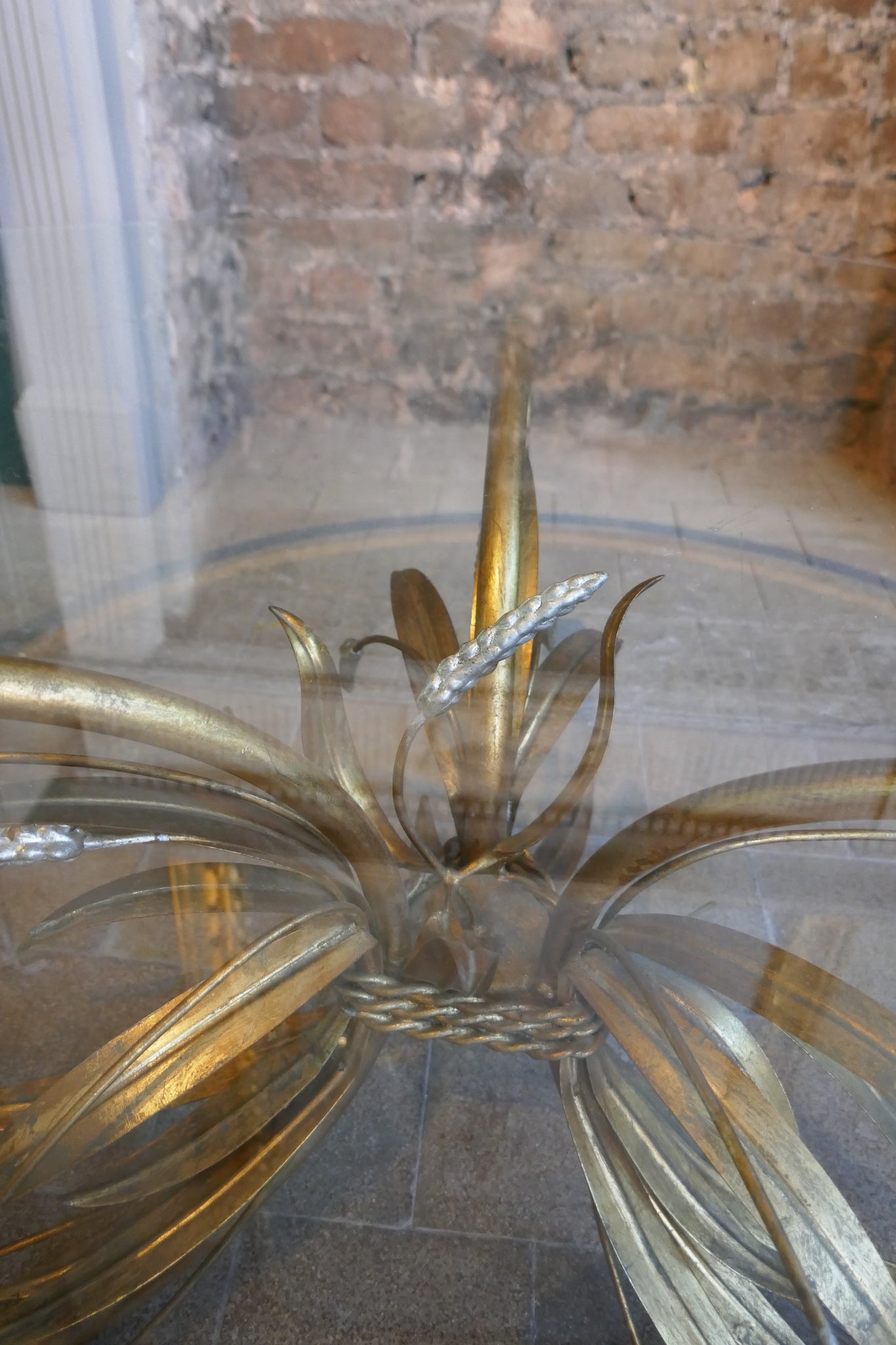 Large 1950's Italian wheatsheaf table with bevelled glass top .