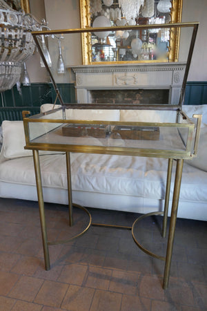 Fabulous quality french brass display cabinet with lift up top and securing side bars circa 1900.