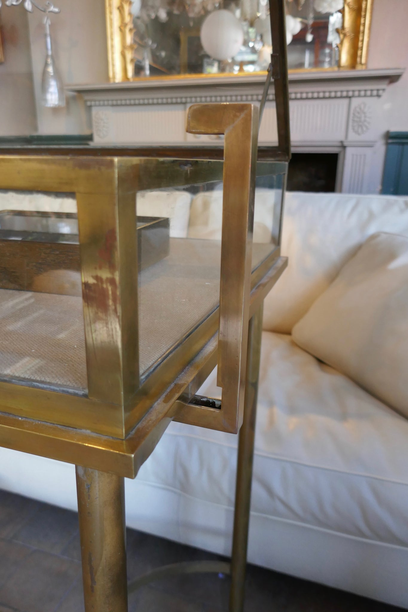 Fabulous quality french brass display cabinet with lift up top and securing side bars circa 1900.