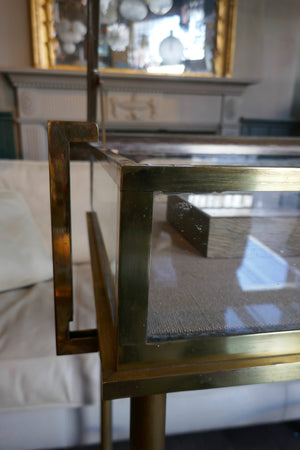 Fabulous quality french brass display cabinet with lift up top and securing side bars circa 1900.