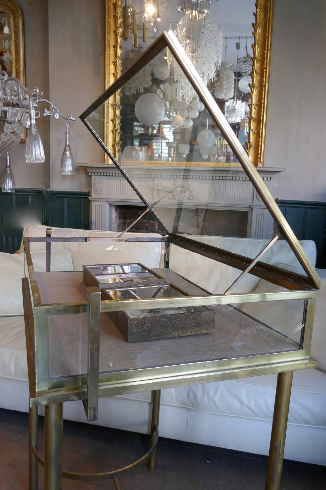 Fabulous quality french brass display cabinet with lift up top and securing side bars circa 1900.